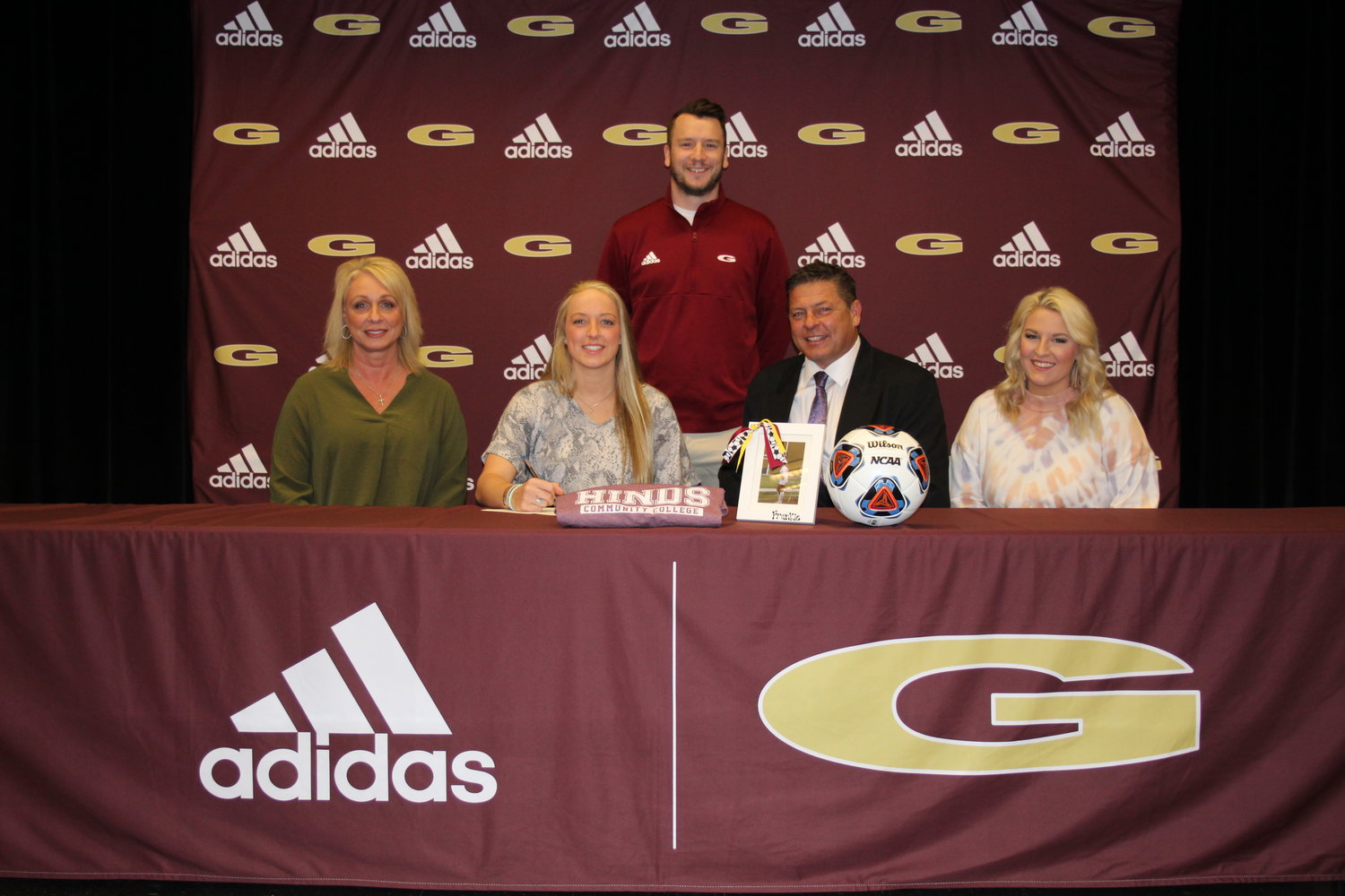 Pictured with Frankie are parents, Kim and John Wood, and sister Hannah. Head Girls Soccer Coach J.T. Coward is also pictured.